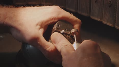 jeweler polishing a ring