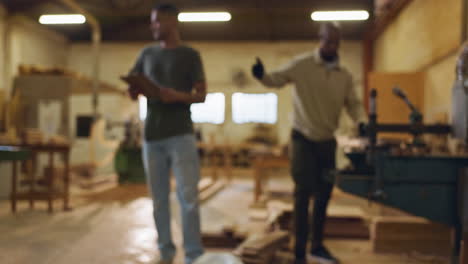 men working in a woodworking workshop