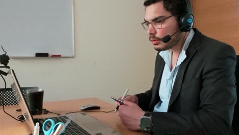e-tutoring session: man taking tablet notes