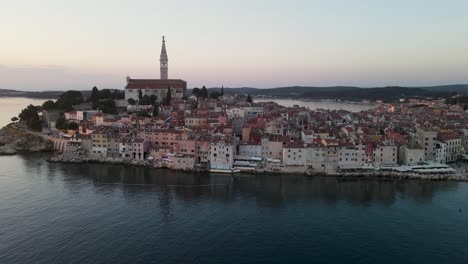 A-drone-shot-orbiting-Rovinj,-Croatia-displays-the-old-world-look-of-life-on-the-Adriatic-Sea