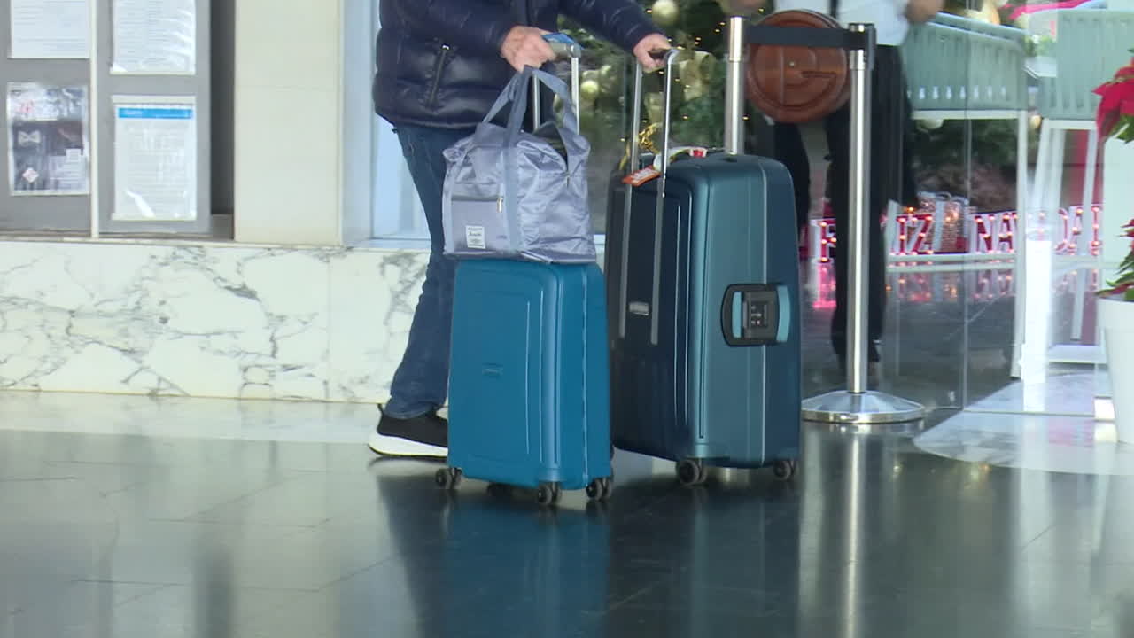 Traveler with Luggage at Airport/Hotel
