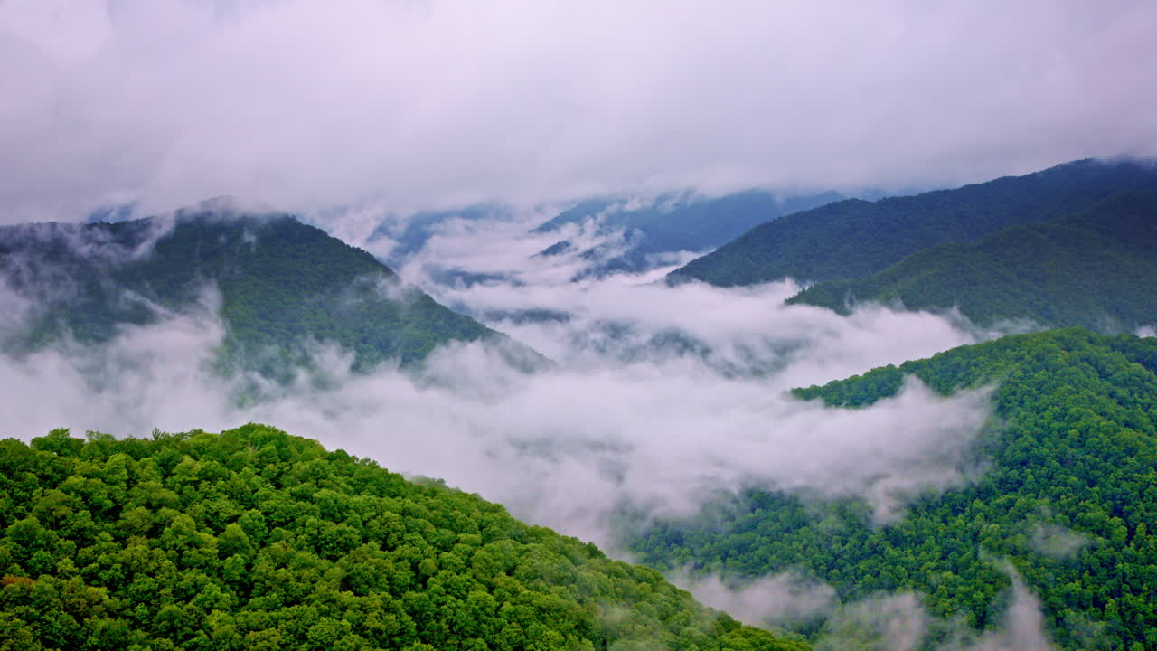 Cloudy veil drapes the Smoky Mountains in this drone capture
