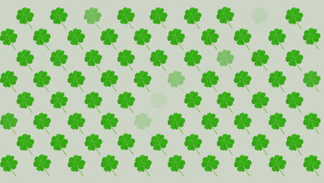 digital animation of multiple clover leaves flickering against grey background