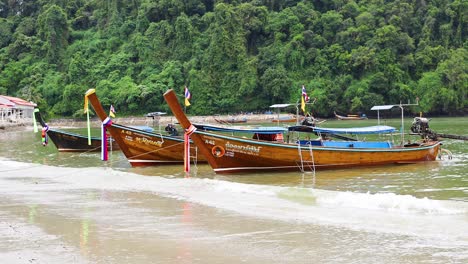 longtail boats on a tropical beach