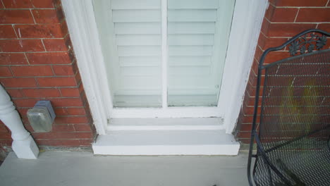 Gimbal shot of the outside of a window in a brick house