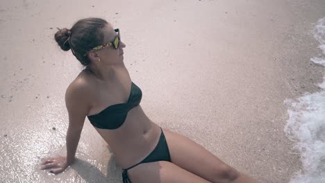 waves-cover-woman-with-hair-bundle-splashing-ocean-water