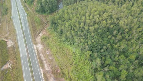 Beautiful Drone View Of Bau To Lundu Pan Borneo Highway During Morning Sunset With Mountain And Valley, Green Forest,Sarawak, Borneo.