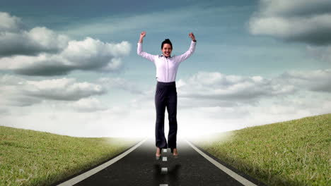 Cheerful-young-businesswoman-jumping-on-street