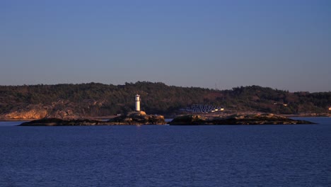 ursholmen lighthouse ytre hvaler national park strömstad stromstad oslo fjord sweden sverige norway norge golden hour arctic sunlight sunset ferry boat ride scandinavia islands parallax right motion