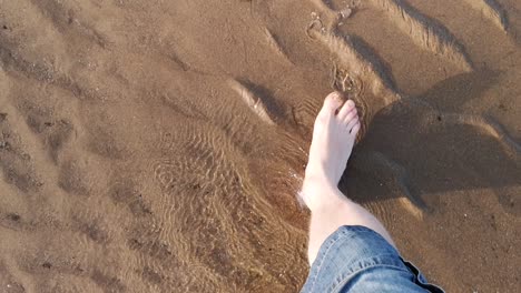 walking barefoot across the beach