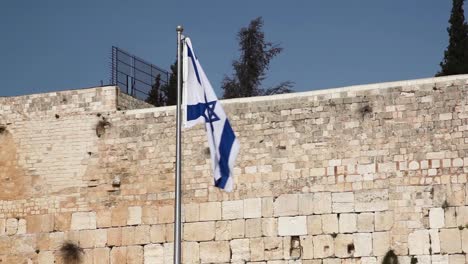 flag of israel and the wailing wall or western wall in jerusalem