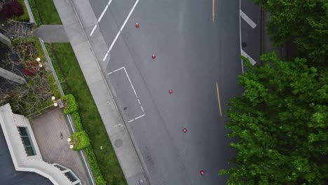 aerial-bird-view-rise-over-pylon-restricted-beachside-modern-hotel-skyrises-from-vehicles-at-tropical-forest-by-the-sea-as-a-bird-flys-by-and-cyclists-ride-by-unified-in-order-by-crosswalk-pylons1-2