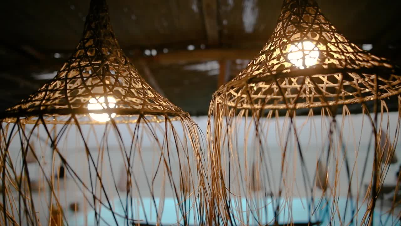 zoom out footage of lamps at beach lounge