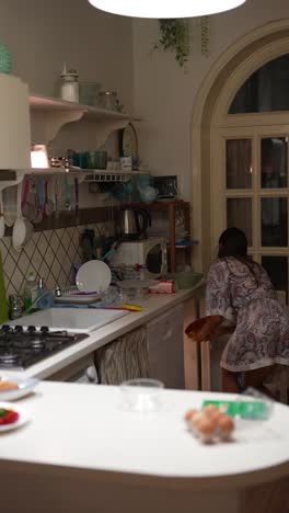 woman preparing breakfast/dinner in a cozy italian kitchen