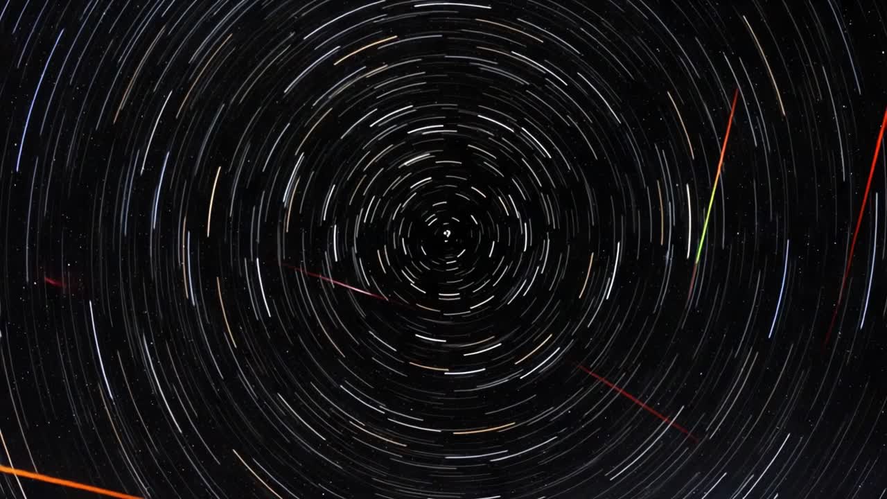 Stunning Display of Star Trails Captured Over Time, Showcasing the Celestial Motion with Vibrant Colors and Circular Patterns in the Night Sky