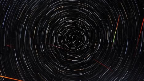 stunning display of star trails captured over time, showcasing the celestial motion with vibrant colors and circular patterns in the night sky