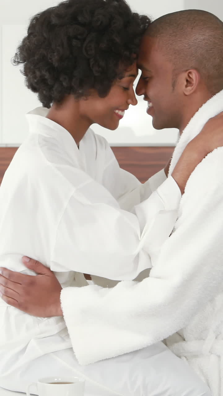 Romantic smiling couple taking breakfast together