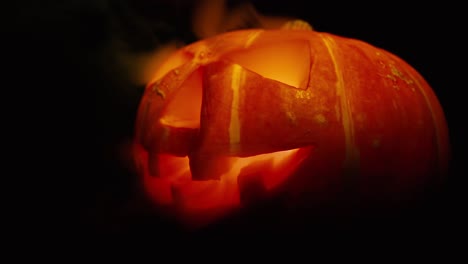 scary old jack-o-lantern on black background.