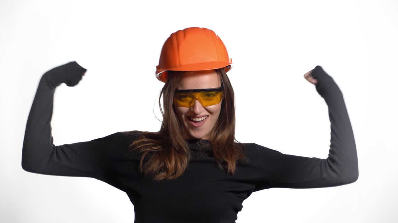 Worker contractor woman. Young woman showing her muscularity. Positive human emotions. Isolated on white background.