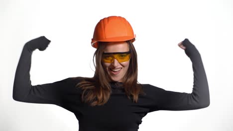 worker contractor woman. young woman showing her muscularity. positive human emotions. isolated on white background.