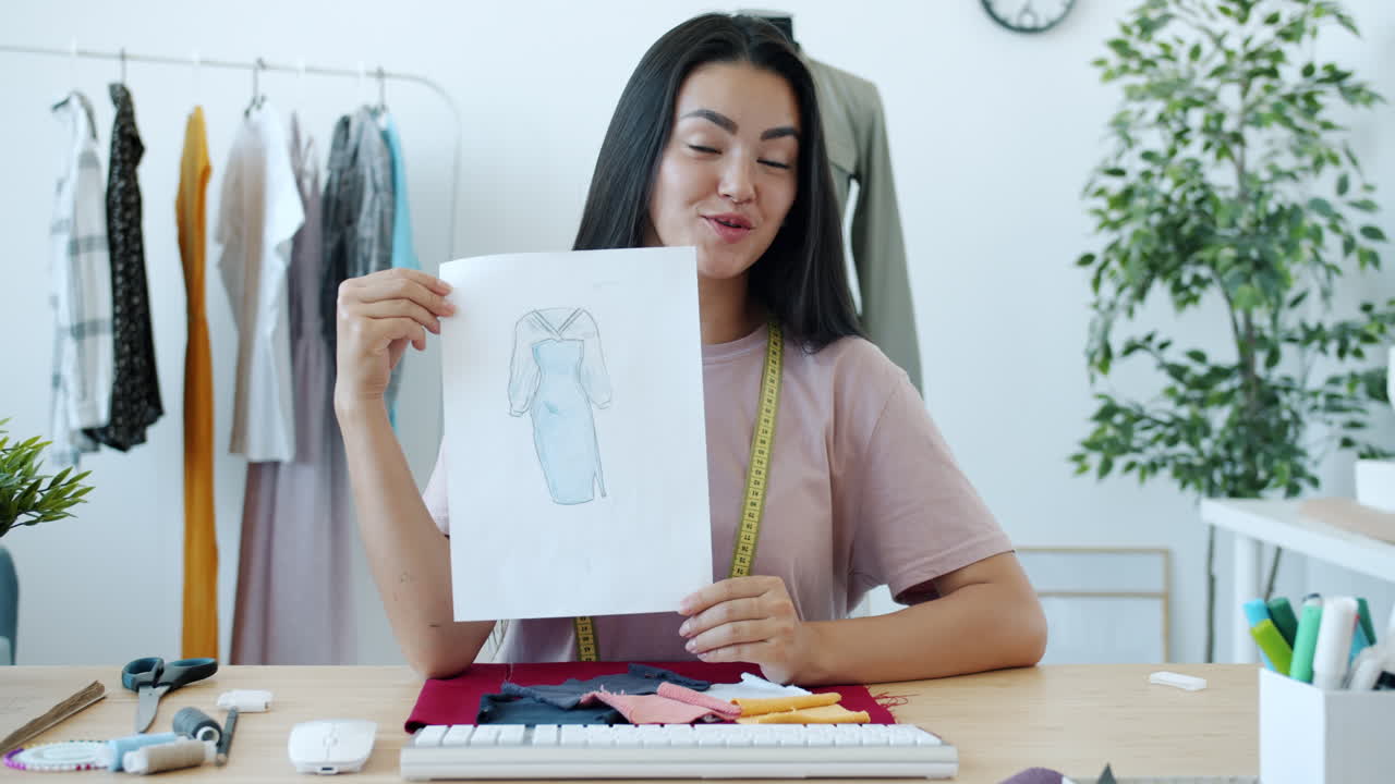 Fashion Designer Presenting Design Sketches and Fabrics