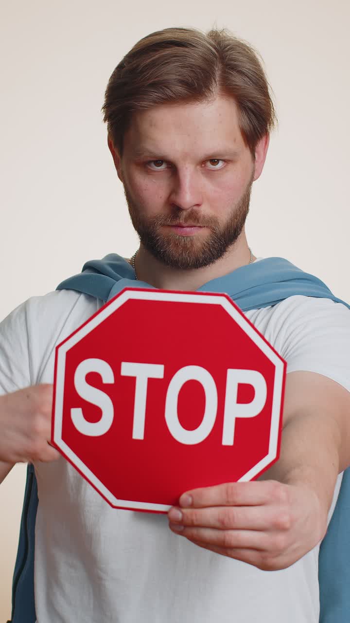 Angry man say no hold stop sign banner logo warning prohibited access danger crisis rejection