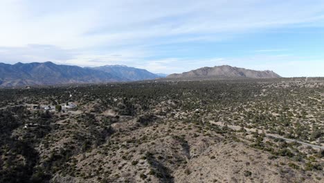 Drone-shot-revealing-wild-landscape-of-Cahuilla-Indian-Reservation-lies-in-high-desert-valley,-California-forest-landscape,-USA