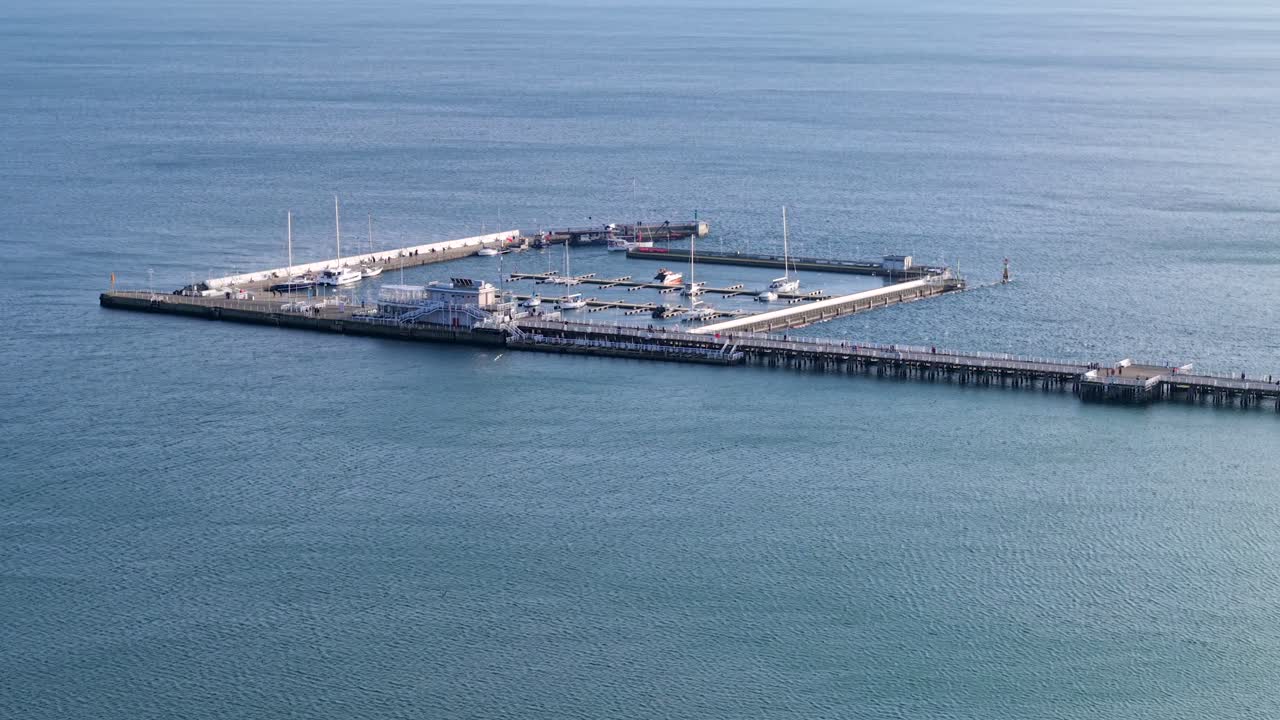 Sailing boats in the marina, with a drone shot over the Sopot Pier in Poland