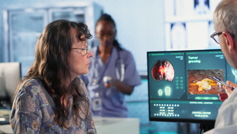 vertical video radiologist discusses an x ray and mri scan helping a male patient