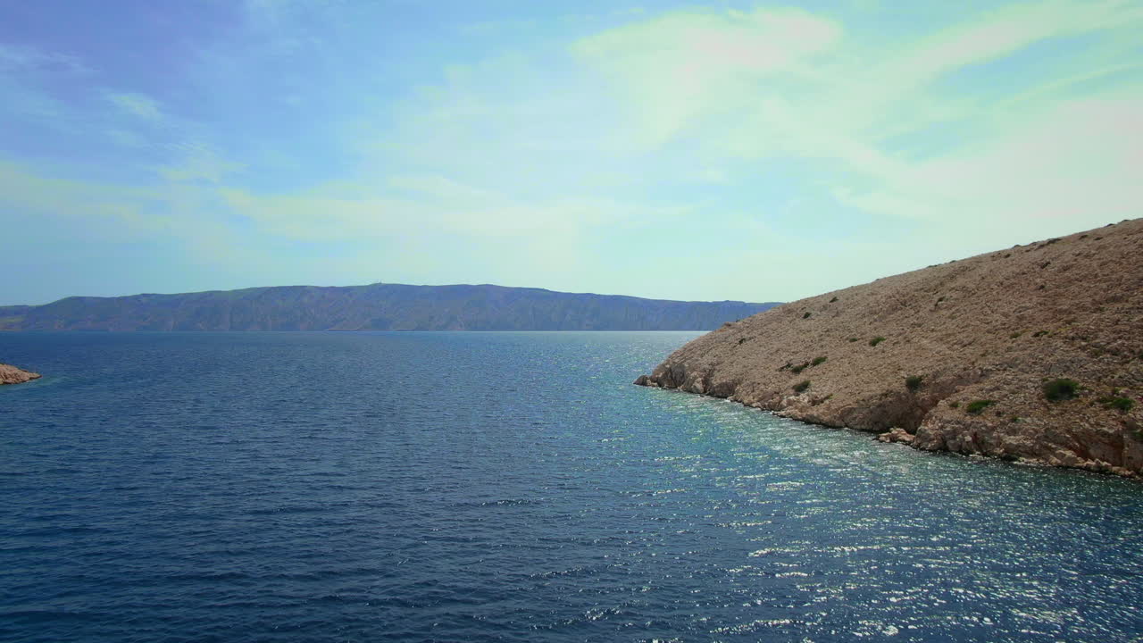 Aerial view of mediterranean coast on Goli Otok island, dolly in, Croatia