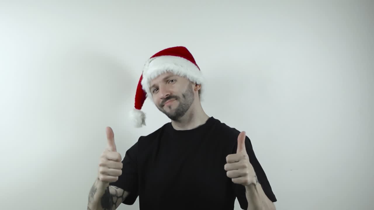 Man in Santa Hat Giving Thumbs Up