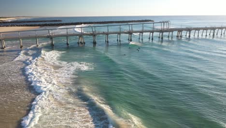 aerial view of the ocean and surfers enjoying a beautiful warm summer day on the gold coast