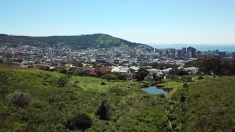 drone shot flying forwards revealing the city of cape town