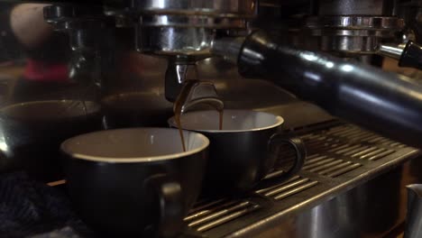 coffee pouring in two cups slow motion