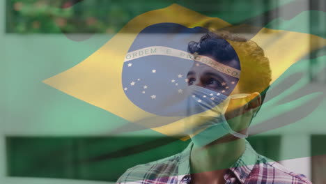 animation of flag of brazil waving over laitn man wearing face mask in city street