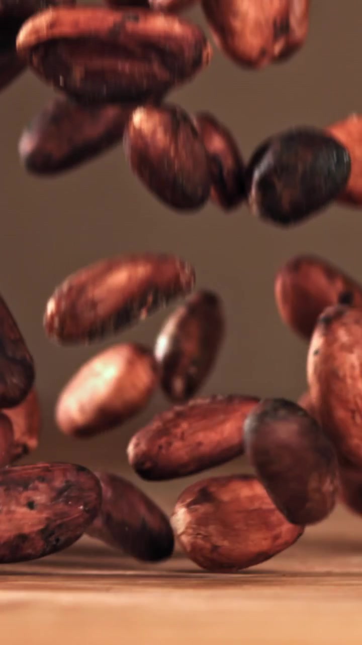 Slow Motion of Cocoa Beans Falling onto a Wooden Surface
