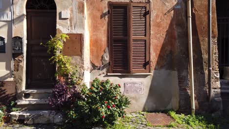 facade of an old building in borghetto di ostia, a district of rome in italy that kept its atmosphere of a medieval village