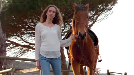 woman walking with horse