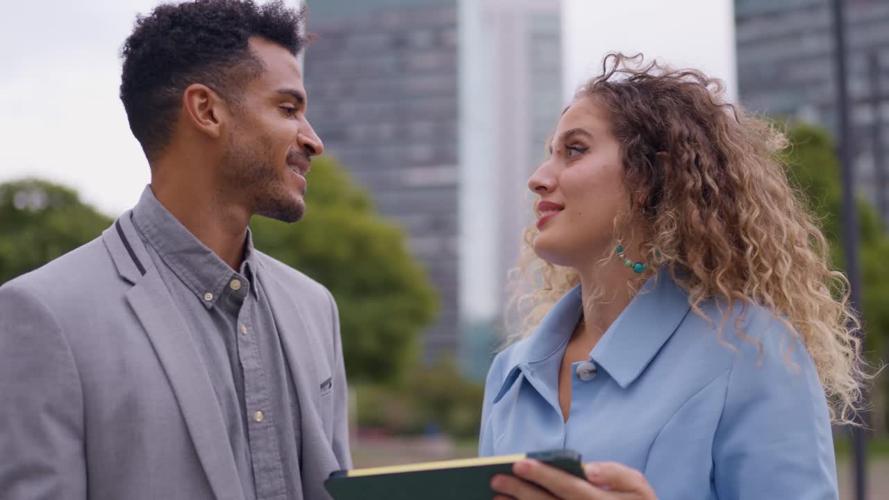 Business professionals meeting outdoors