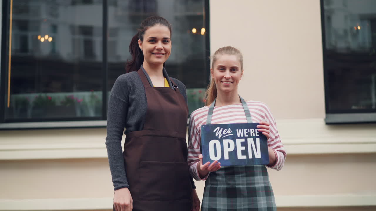 Two Women Announcing Store Opening