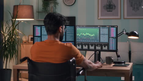 person using computer at home for investment