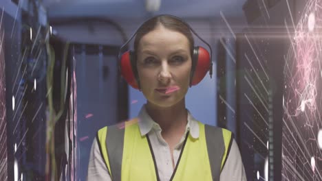 Animation-of-lights-and-lines-over-caucasian-woman-working-in-server-room