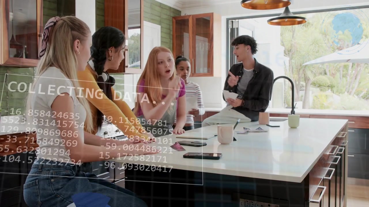 Team at island, woman tapping tablet sparking live charts, sharing papers, analyzing business data
