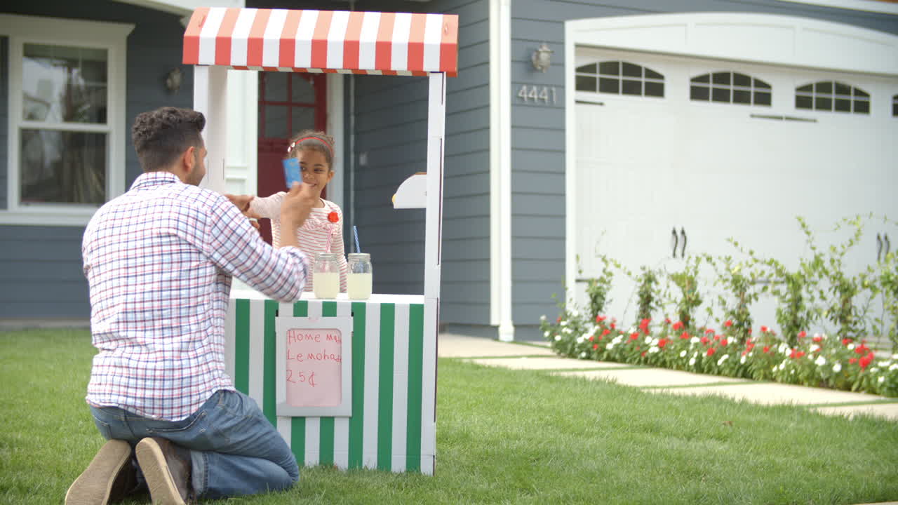 Man Buying Lemonade From Children's Stall Shot On R3D