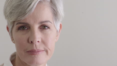 middle-aged-caucasian-woman-looking-at-camera-successful-senior-female-on-blank-background-copy-space-close-up