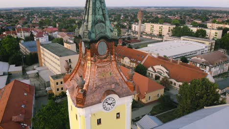 Close-up-shot-about-a-Hungarian-church-by-drone,-part-of-the-roof-rebuilt-with-copper