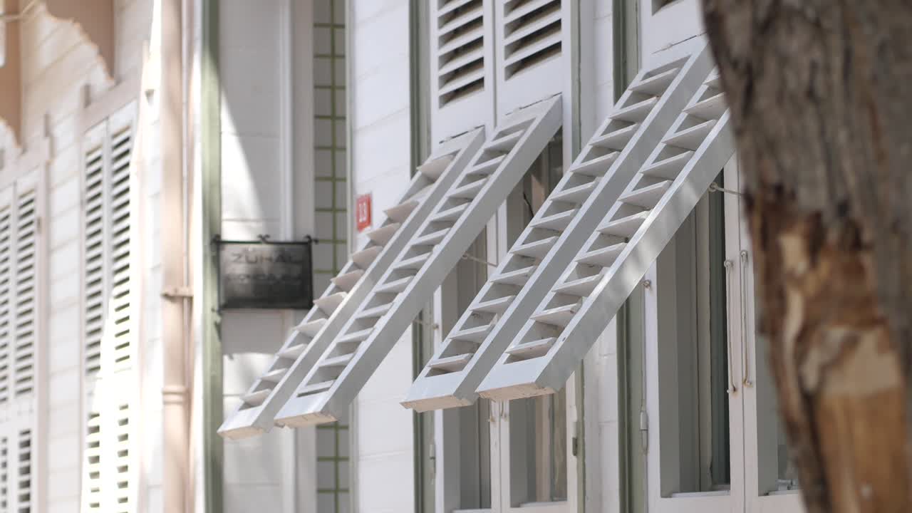 White Building with Wooden Shutters