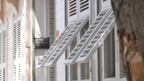white building with wooden shutters