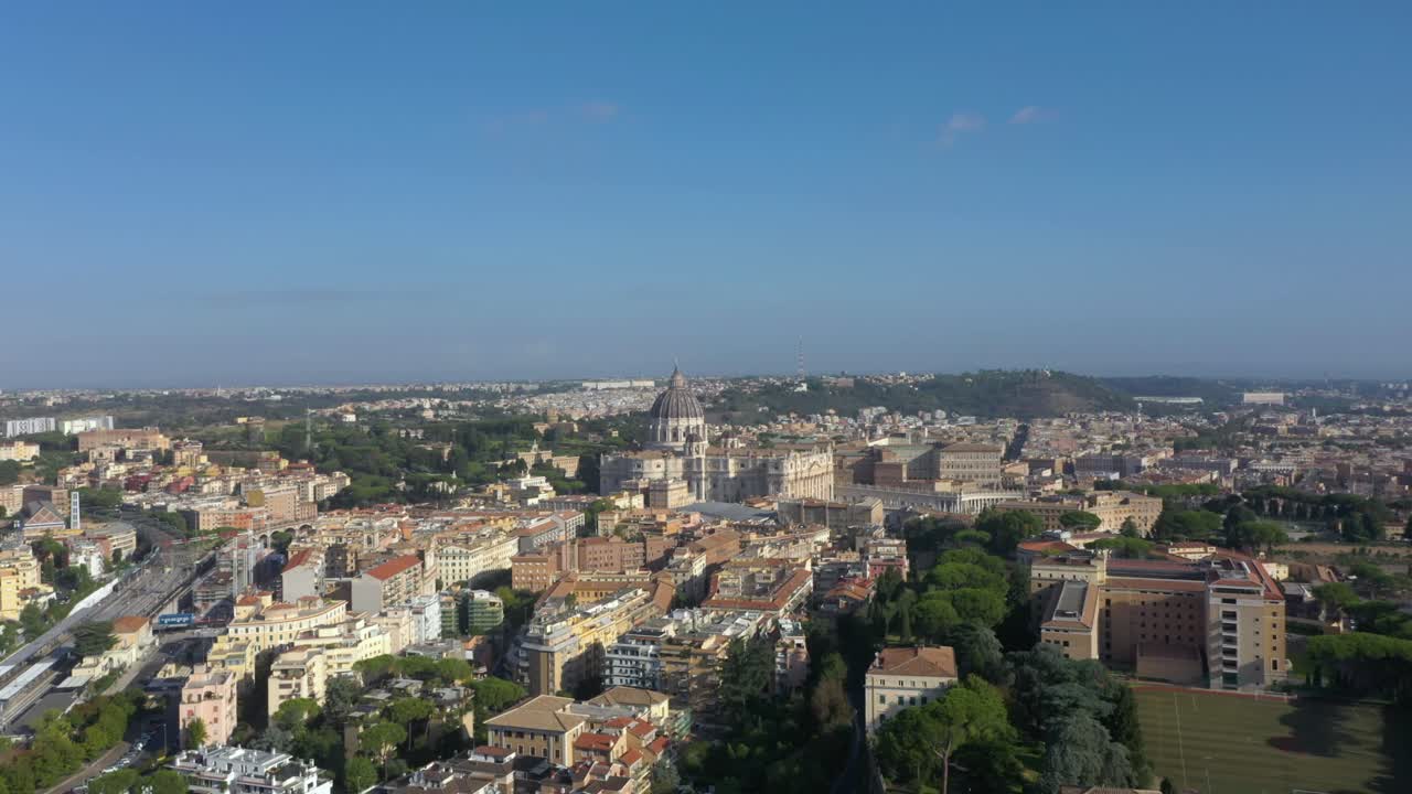 Wide view aerial flying towards the Vatican capturing St. Peter’s Basilica, its majestic dome, and Piazza San Pietro in breathtaking aerial detail
