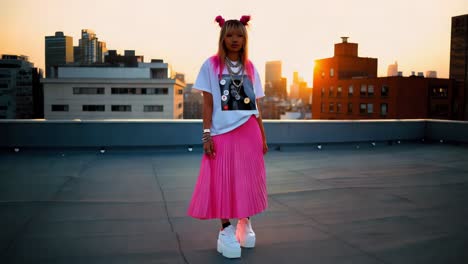 stylish woman on rooftop at sunset